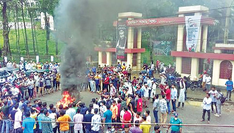 MC College students burn tyres while staging a demonstration in front of the college on Sylhet–Tamabil Highway in protest against the rape reportedly by Bangladesh Chhatra League activists in the college hostel. — New Age file photo