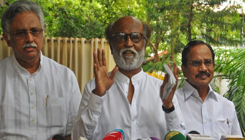 Indian actor Rajinikanth addresses the media representatives in front of his residence in Chennai on Thursday. — AFP photo