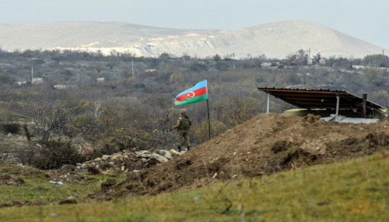 An Azerbaijani soldier stands guard at a checkpoint on a road entering Fizuli from Hadrut on December 2, 2020, a day after Baku's army entered the final district given up by Armenia under a peace deal that ended weeks of fighting over the disputed Nagorno-Karabakh region.- AFP photo