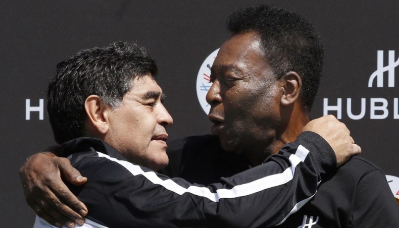 This file photo taken on June 09, 2016 shows Argentine football Diego Maradona (L) and Brazilian football legend Pele hug each other after a match organised by Swiss luxury watchmaker Hublot at the Jardin du Palais Royal in Paris. — AFP photo