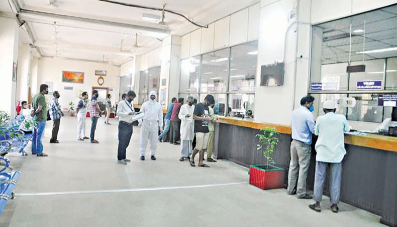 A file photo shows clients receiving services at a branch of a bank in the capital. Capital shortfall in eleven banks totalled at Tk 19,296.08 crore at the end of September 2020 thanks to the Bangladesh Bank’s policy relaxations amid the COVID-19 outbreak. — New Age photo