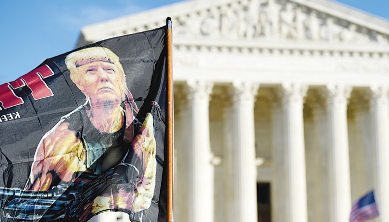 Supporters of US president Donald Trump participate in the ‘Million MAGA March’ to protest the outcome of the 2020 presidential election in front of the US Supreme Court on December 12 in Washington, DC. — Agence France-Presse/Olivier Douliery