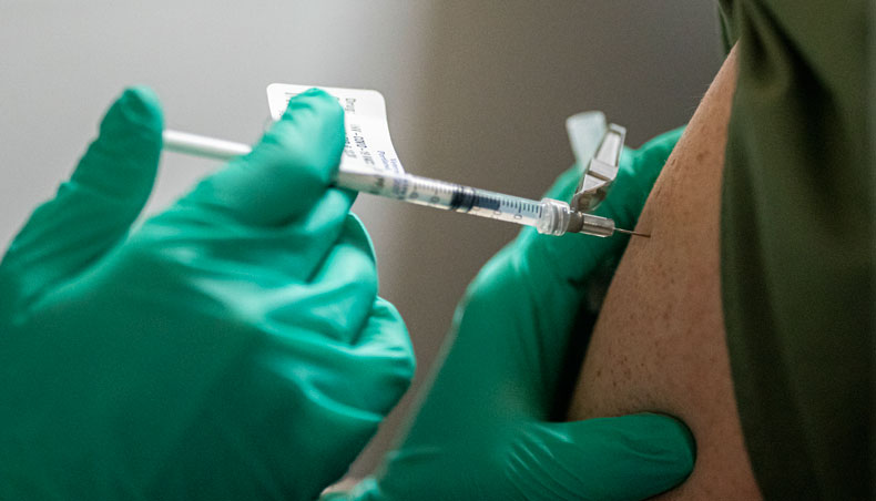 A healthcare worker at the Portland Veterans Affairs Medical Centre receives a COVID-19 vaccination on December 16, 2020 in Portland, Oregon. — AFP photo