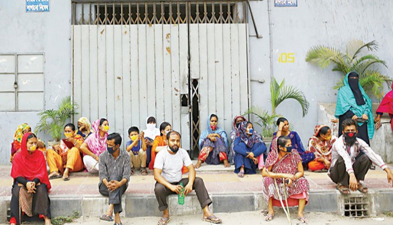A file photo shows workers protesting against non-payment of wages in front of a readymade garment factory in the capital on April 16. About 14 lakh or 42 per cent of workers in the country’s readymade garment sector did not get benefits from the stimulus package provided by the government to pay the workers’ wages amid the COVID-19 outbreak, according to a survey conducted by the Transparency International Bangladesh.— New Age photo
