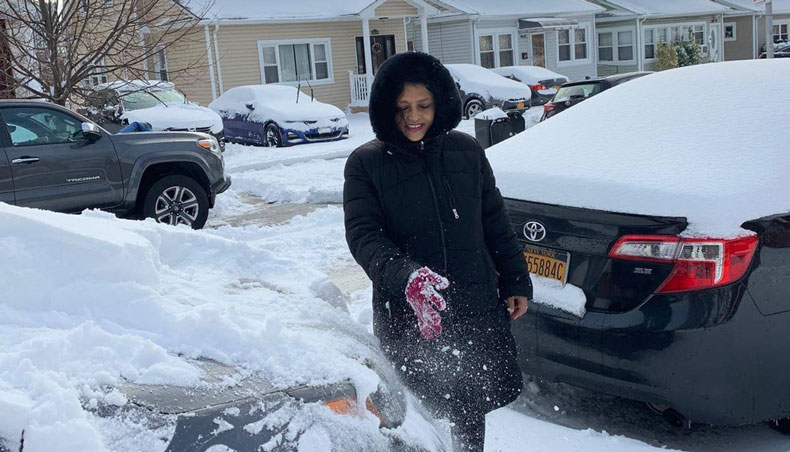 A Bangladeshi woman revels in snow in New York on Thursday- Collected Photo