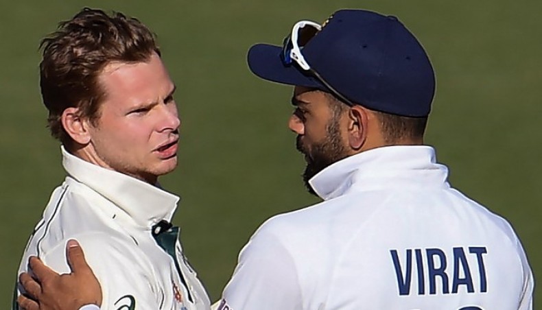 A file photo from December 19, 2020 shows Australia's Steve Smith (L) talking to India's Virat Kohli at the end of their first Test in Adelaide. — AFP photo