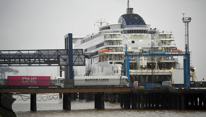 Freight lorries and heavy goods vehicles wait to board a P&O ferry in Hull, north east England, on December 21, 2020, as a string of countries banned travellers arriving from the UK, due to the rapid spread of a more-infectious new coronavirus strain. — AFP photo