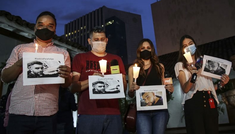 Journalists and photographers pay tribute to colleague Felipe Guevara, who died earlier, two days after being shot, in Cali, Colombia, on December 23, 2020. -- AFP photo