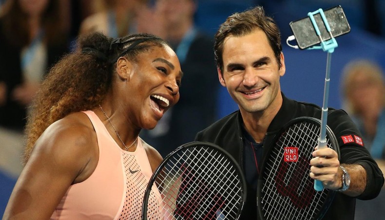 A file photo shows Serena Williams and Roger Federer sharing a light moment. -- AFP photo