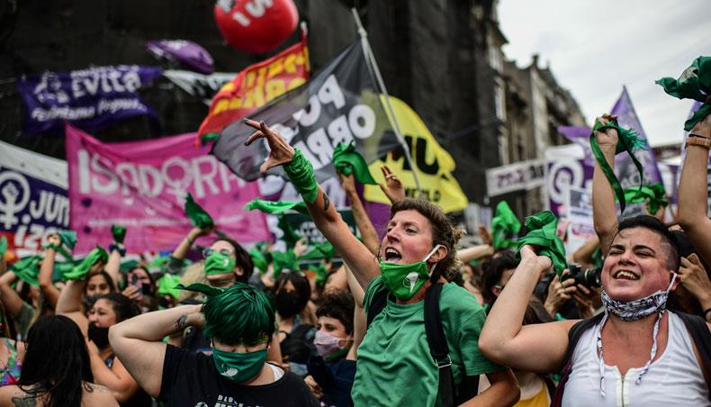 In this file photo taken on December 11, 2020 demonstrators celebrate with green headscarves — the symbol of abortion rights activists — outside the Argentine Congress in Buenos Aires on December 11, 2020, after legislators passed a bill to legalise abortion. — AFP photo