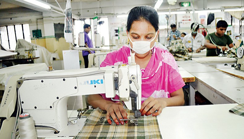 A file photo shows readymade garment workers sewing clothes at a factory on the outskirts of Dhaka. Labour leaders have opposed and condemned the apparel factory owners’ proposal to suspend the legal provision of 5 per cent yearly increment for RMG workers for two years. — New Age photo
