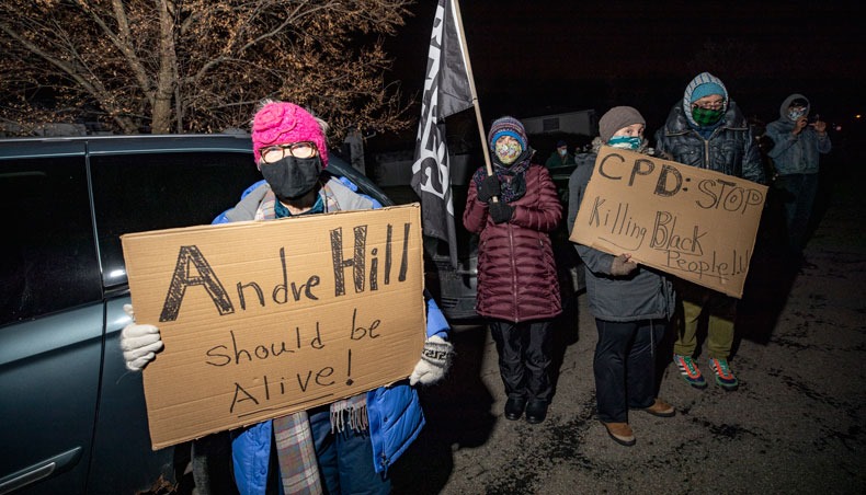 Ginnie Vogts, a representative from Showing Up for Racial Justice Columbus, along with other allies participate in a call to action ‘White People Stop Calling the Cops on Black People’ protest hosted by SURJ in front of the house of the neighbour who called the police on Andre Hill the night he was shot and killed in Columbus, Ohio on December 28, 2020. — AFP photo