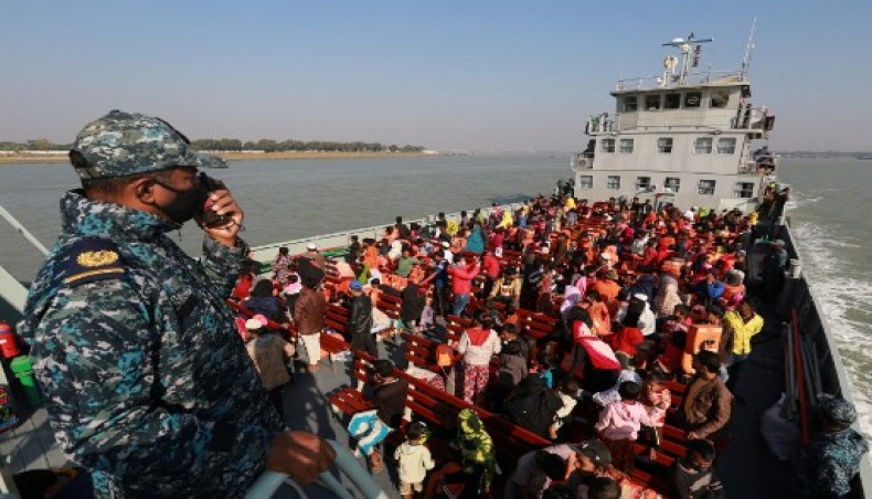 Rohingya refugees sit on a Bangladesh Navy ship as they are relocated to the controversial flood-prone island Bhashan Char in the Bay of Bengal, in Chittagong on December 29, 2020. - AFP photo