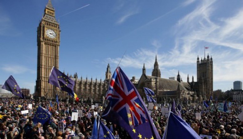 In this file photo taken on March 25, 2017 Demonstrators holding EU and Union flags gather in front of the Houses of Parliament in Parliament Square following an anti Brexit, pro-European Union (EU) march in London on March 25, 2017, ahead of the British government's planned triggering of Article 50 next week.- AFP photo
