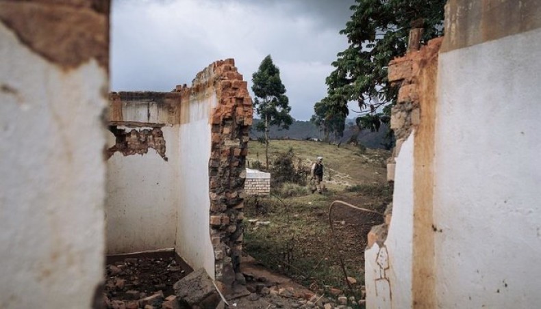 A file photo from October 11, 2020 shows a Pakistani United Nations Organisation Stabilization Mission in the Democratic Republic of the Congo peacekeeper walking past the ruins of the Bijombo health centre destroyed by armed men, South Kivu Province, eastern Democratic Republic of Congo. — AFP photo