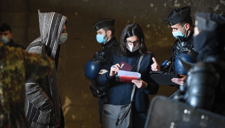 French Gendarmes break up a rave near a disused hangar in Lieuron about 40km south of Rennes, on January 2, 2021. — AFP Photo