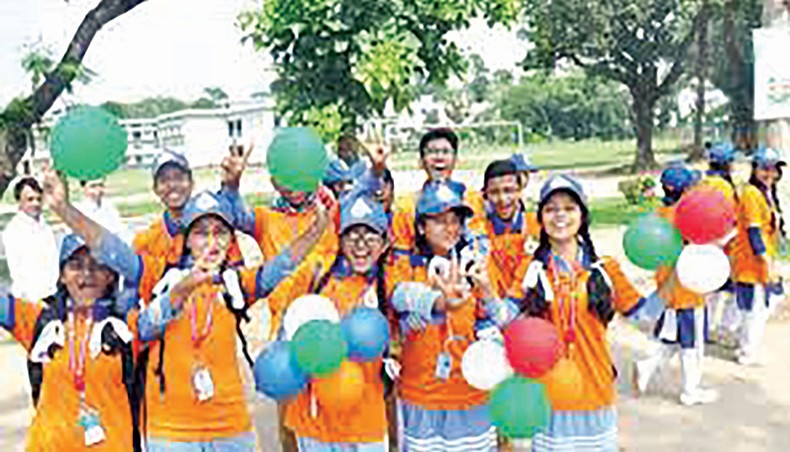 A file photo shows students cheering up on Dhaka Residential Model School campus in Dhaka on May 12, 2018 as they join a Bangladesh Bank conference on banking. Income from school banking deposits is facing higher tax as students who have opened the school banking accounts do not have taxpayers’ identification numbers. — New Age photo