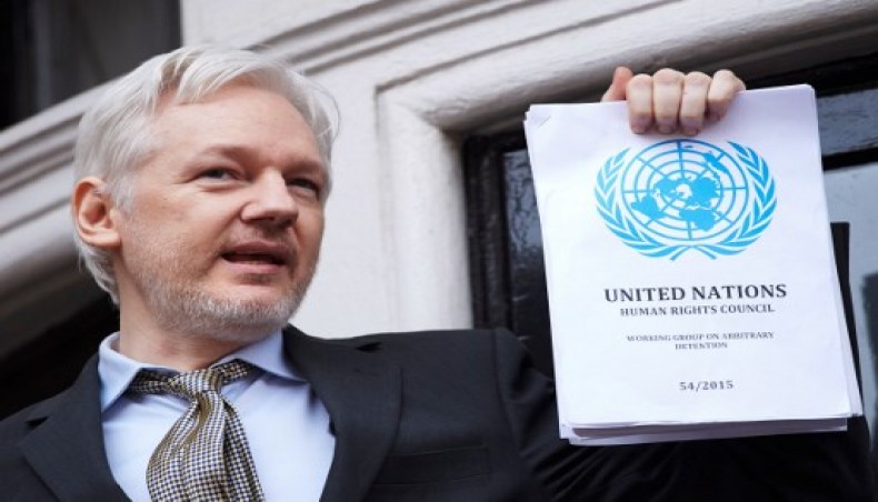 In this file photo taken on February 05, 2016 WikiLeaks founder Julian Assange addresses the media holding a printed report of the judgement of the UN's Working Group on Arbitrary Detention on his case from the balcony of the Ecuadorian embassy in central London on February 5, 2016. - AFP photo