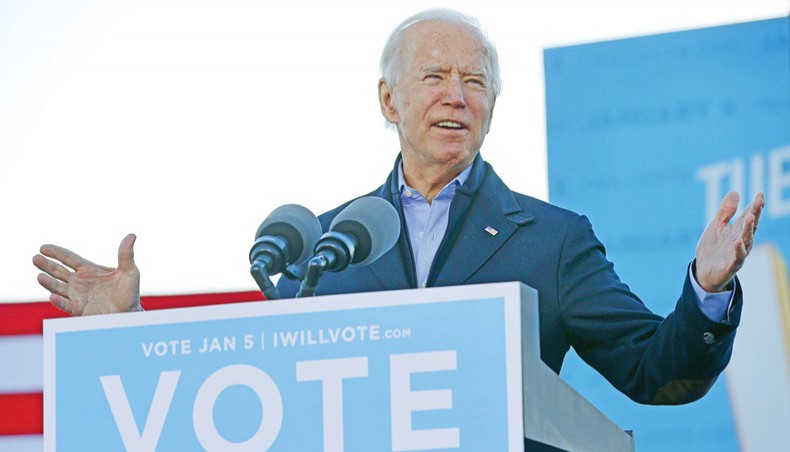 President-elect Joe Biden addresses a campaign rally with Democratic candidates for the US senate Jon Ossoff and Rev Raphael Warnock the day before their runoff election in the parking lot of Centre Parc Stadium on January 4 in Atlanta, Georgia. — Agence France-Presse/Getty Images/Chip Somodevilla