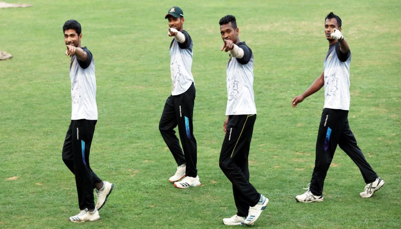 Bangladesh cricketers (from L-R) Mahmudullah, Nazmul Hossain, Al-Amin Hossain and Rubel Hossian gesture during a training session at the Sher-e-Bangla National Stadium on Tuesday.-- BCB photo