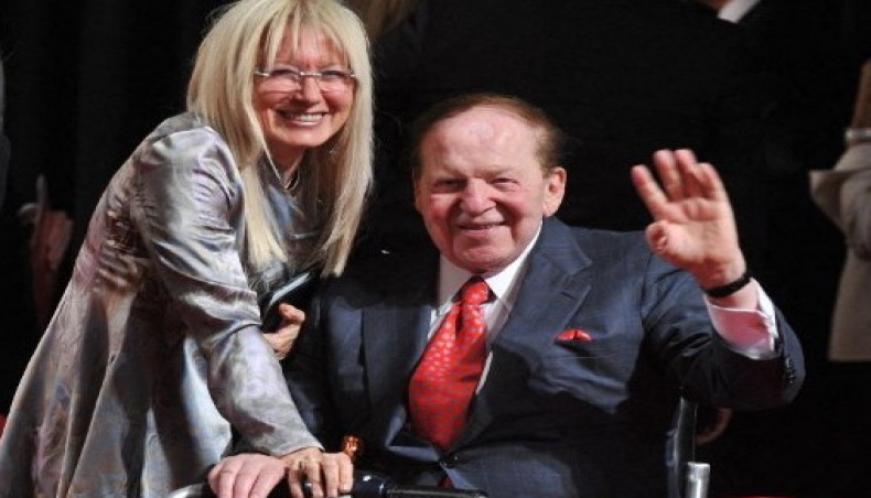 In this file photo US business magnate Sheldon Adelson and his wife Miriam Ochsorn pose for photographers after attending the first presidential debate between US President Barack Obama and Republican challenger Mitt Romney in Denver,Colorado on October 3, 2012.- AFP photo