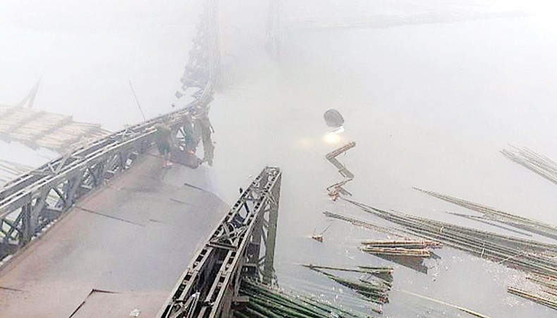 A bailey bridge with a truck on it collapses at Kutukchhari in Rangamati on Tuesday morning. — New Age photo