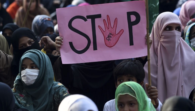 In this file photo taken on September 17, 2020, a supporter of Pakistani Islamic political party Jamaat-e-Islami holds a placard reading 'Stop' during a protest against an alleged gang rape of a woman, in Lahore. -- AFP Photo