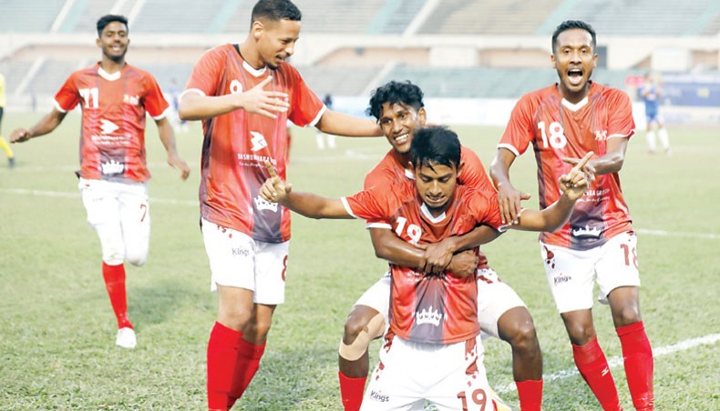 Bashundhara Kings midfielder Mohammad Ibrahim (C) celebrates after scoring his team’s second goal during their Football League match against Uttar Baridhara at the BNS on Wednesday. — New Age photo