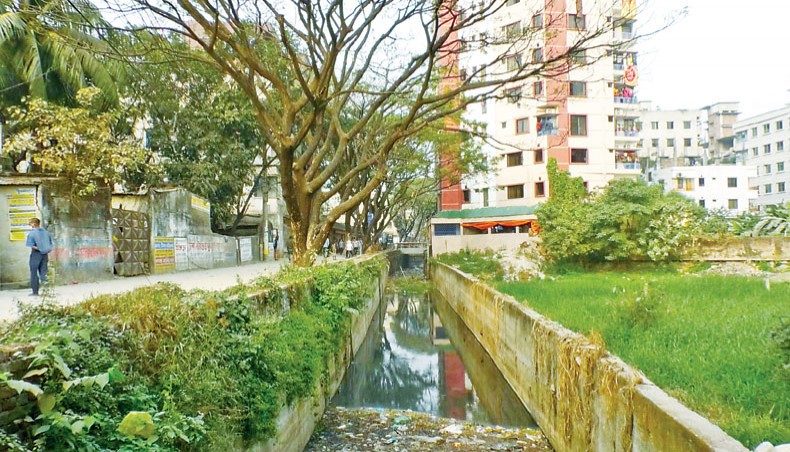 Jirani Khal is turned into a narrow culvert following encroachment on a portion of it at Kadamtala of Basabo in Dhaka. This photo was taken on Wednesday. — Abdullah Apu