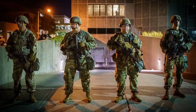 In this file photo National guards stand in a line during a protest against the shooting of Jacob Blake in Kenosha, Wisconsin on August 27, 2020. -- AFP Photo