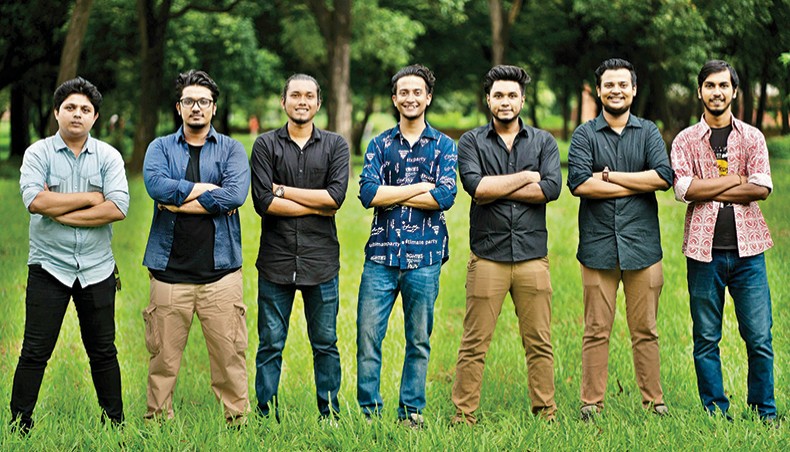 Tasrif Khan, centre, along with members of Kureghor pose for a photo.