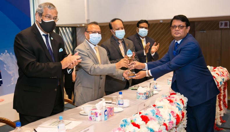Premier Bank Limited managing director and chief executive officer M Reazul Karim receives certificate and crest from local government, rural development and cooperatives minister Md Tazul Islam at a programme held at a city hotel on Saturday, January 16, 2021.- Press Release photo