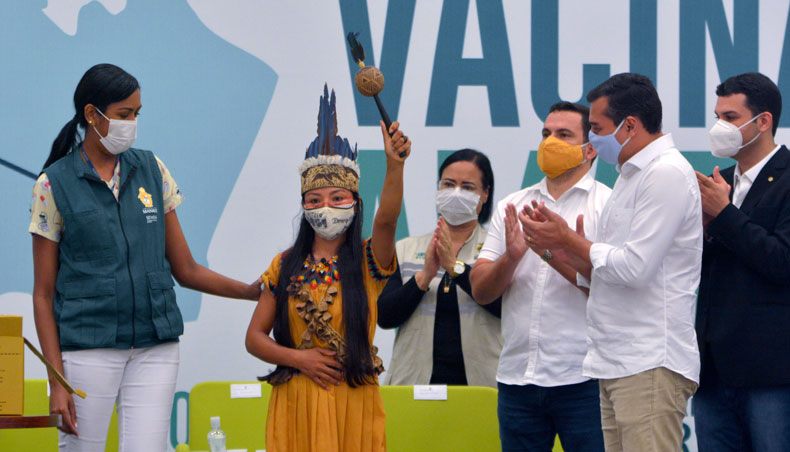 Witoto’s indigenous nurse Vanda Ortega is seen showing her vaccine certificate after becoming the first person to be inoculated with the Sinovac Biotech’s CoronaVac vaccine against COVID-19 in Manaus, Amazonas state, Brazil, on January 18, 2021. — AFP photo