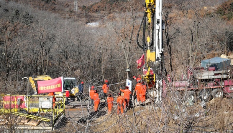 Members of a rescue team work at the site of a gold mine explosion where 22 miners are trapped underground in Qixia, in eastern China's Shandong province on January 18, 2021. -- AFP Photo