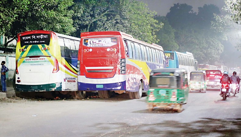 Buses parked on almost half a road render it narrow and prone to accident. This photo was taken at Kamalapur in Dhaka on Tuesday. — Sourav Lasker