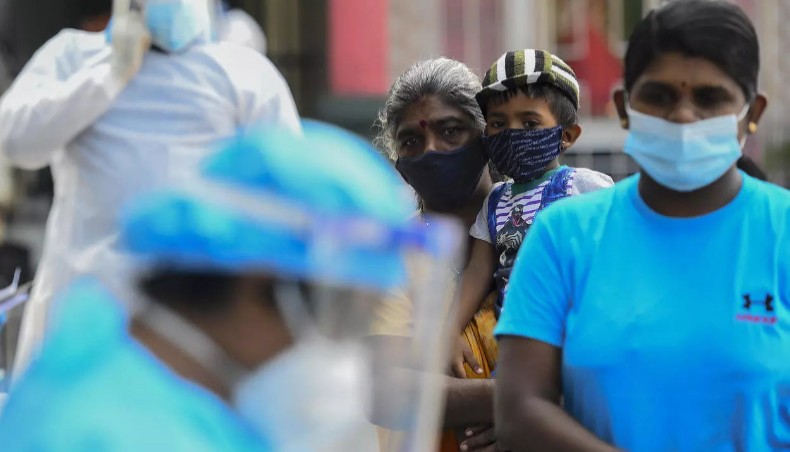Residents wait in a line to get tested for coronavirus infections in Colombo in January. There has been a resurgence of infections in the country. — AFP Photo
