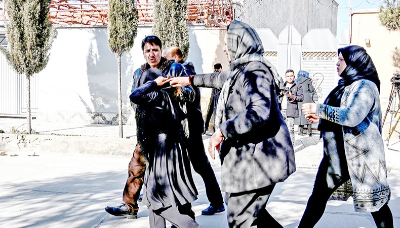 Relatives of the victims arrives at the site after gunmen shot dead two Afghan women judges working for the Supreme Court in Kabul on January 17.— Agence France-Presse/Wakil Kohsar