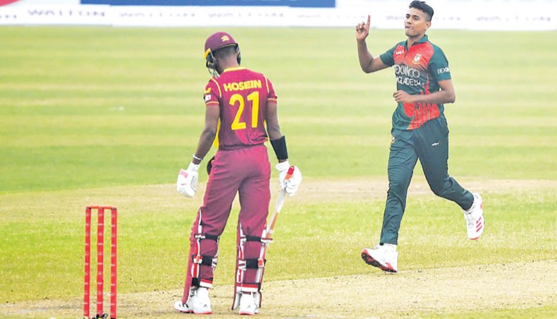 Bangladesh pacer Hasan Mahmud (R) celebrates the wicket of West Indies batsman Akeal Hosein during the first ODI match at the Sher-e-Bangla National Stadium on Wednesday. — AFP photo