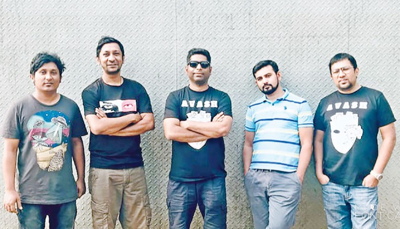 Tanzir Tuhin, second from left, along with members of Avash pose for a photo.