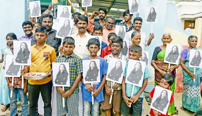 Villagers pose holding photos of US vice president-elect Kamala Harris at her ancestral village of Thulasendrapuram in the southern Indian state of Tamil Nadu on Wednesday. — AFP photo