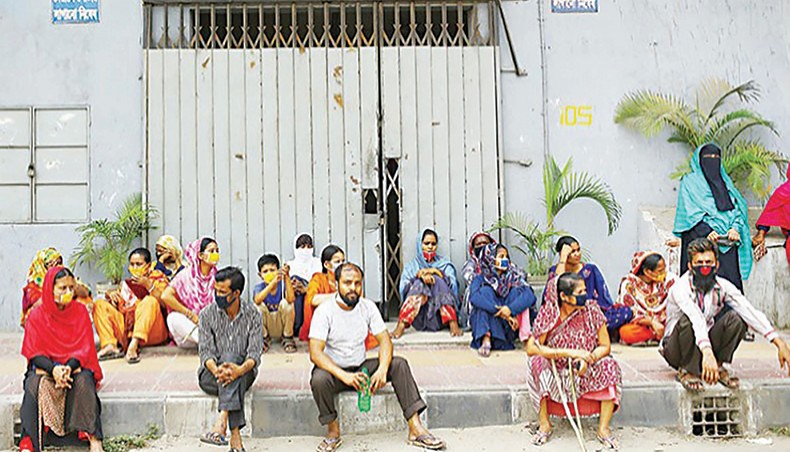 A file photo shows workers protesting against non-payment of wages in front of a readymade garment factory in the capital on April 16. Experts and labour leaders on Wednesday stressed the need for proper implementation of labour laws and rights along with continued reforms in the sector to become eligible for the GSP+ scheme in the European market in the post-graduation period from the least developed country status. — New Age photo
