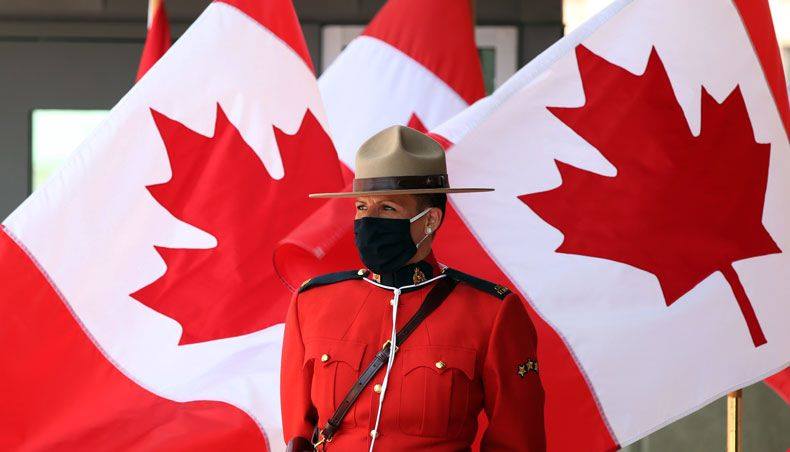 A Royal Canadian mounted police officer stands guard outside the Senate of Canada prior to the speech from the throne September 23, 2020 in Ottawa, Canada. — AFP file photo