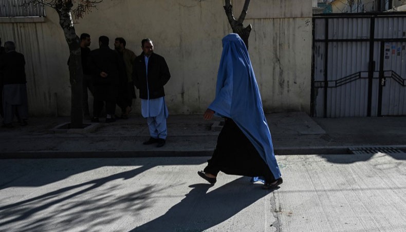 A woman wearing a burqa walks on a street in Kabul on January 17, 2021. — AFP Photo