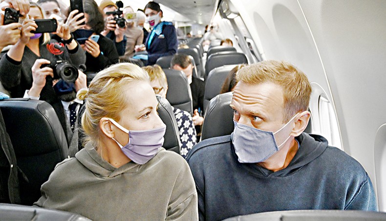 Russian opposition leader Alexey Navalny and his wife Yulia sit in a Pobeda airlines plane heading to Moscow before take-off from Berlin Brandenburg Airport in Schoenefeld, southeast of Berlin, on January 17. — Agence France-Presse/Kirill Kudryavtsev