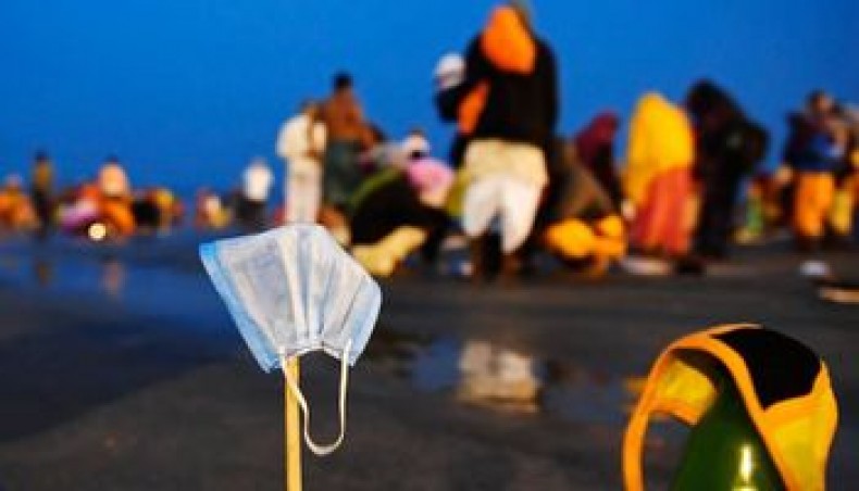 Facemasks of Hindu pilgrims kept for drying are pictured at the confluence of Ganges and the Bay of Bengal during the Gangasagar Mela on the occasion of Makar Sankranti, a day considered to be of great religious significance in Hindu mythology, at Sagar Island, around 150 kms south of Kolkata on January 14, 2021. — AFP photo