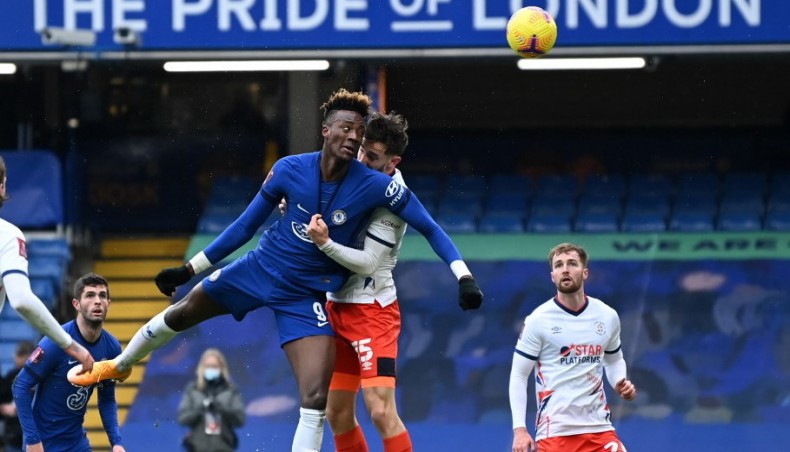Chelsea striker Tammy Abraham (centre left) heads home their second goal during their FA Cup fourth round match against Luton Town at Stamford Bridge in London on Sunday. — AFP photo