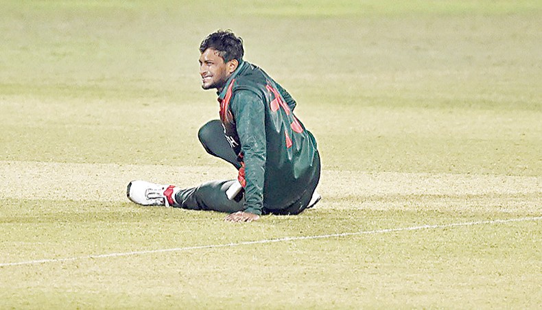 Bangladesh all-rounder Shakib Al Hasan reacts after suffering an injury during their third ODI match against West Indies in Chattogram on Monday. — AFP photo