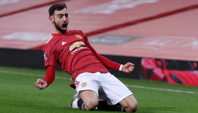 Manchester United midfielder Bruno Fernandes celebrates after scoring his team's third goal against Liverpool during their FA Cup fourth round match at Old Trafford on Sunday.-- AFP photo
