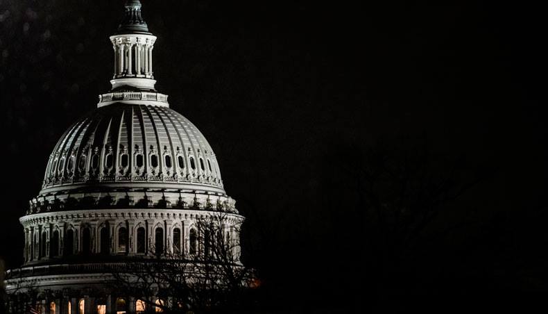 Snow falls around the US Capitol after the House impeachment managers delivered the articles of impeachment to the Senate on January 25, 2021 in Washington, DC. — AFP photo