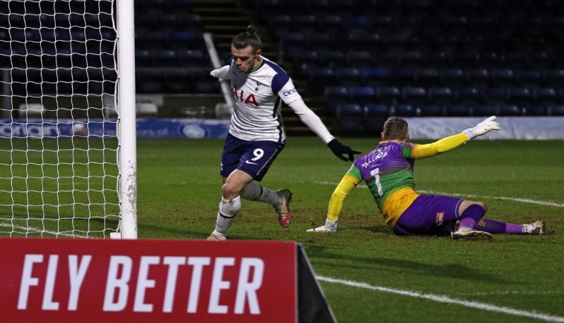 Tottenham Hotspur striker Gareth Bale (L) celebrates after scoring his team’s opening goal against Wycombe Wanderers during their FA Cup fourth round match at Adams Park Stadium in High Wycombe on Monday. — AFP photo